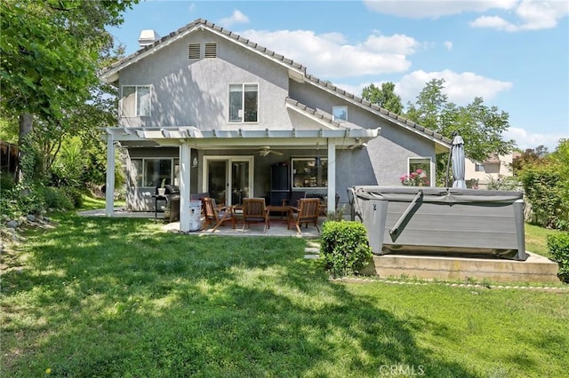 312 Barrington Cir, Redlands, CA 92374 - back of property featuring a hot tub, a pergola, stucco siding, and a patio