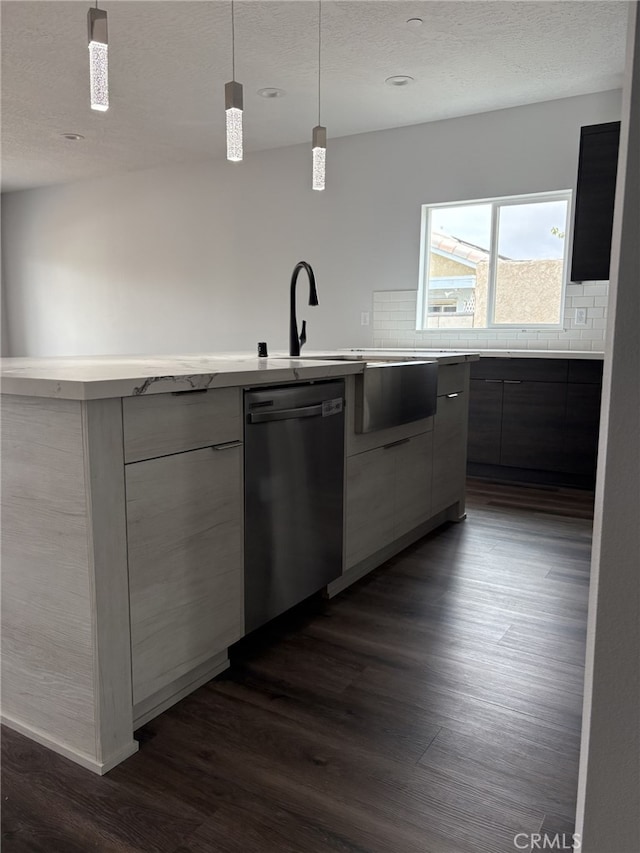 12525 Spring Valley Pkwy, Victorville, CA 92395 - kitchen with backsplash, dark wood finished floors, stainless steel dishwasher, and modern cabinets