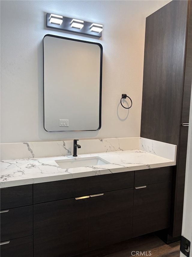 12525 Spring Valley Pkwy, Victorville, CA 92395 - bathroom featuring wood finished floors and vanity