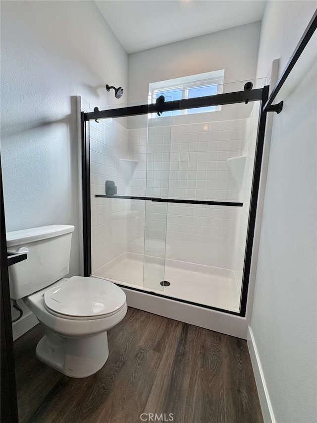 12525 Spring Valley Pkwy, Victorville, CA 92395 - full bath with toilet, wood finished floors, and a stall shower