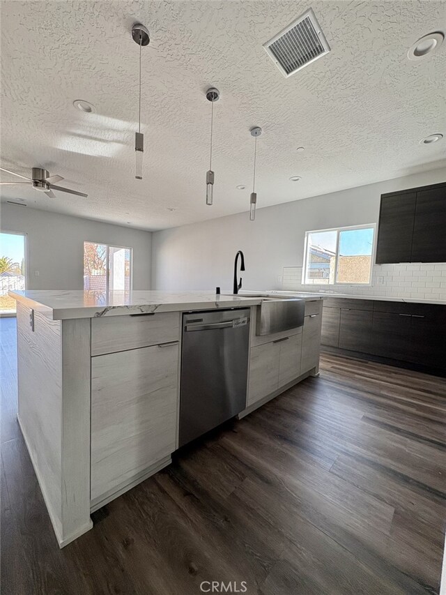 12525 Spring Valley Pkwy, Victorville, CA 92395 - kitchen with visible vents, stainless steel dishwasher, modern cabinets, a textured ceiling, and open floor plan