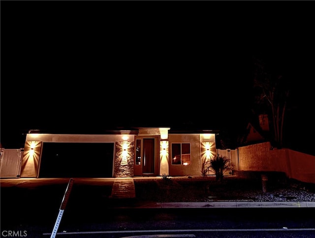 12525 Spring Valley Pkwy, Victorville, CA 92395 - view of front facade featuring an attached garage and driveway