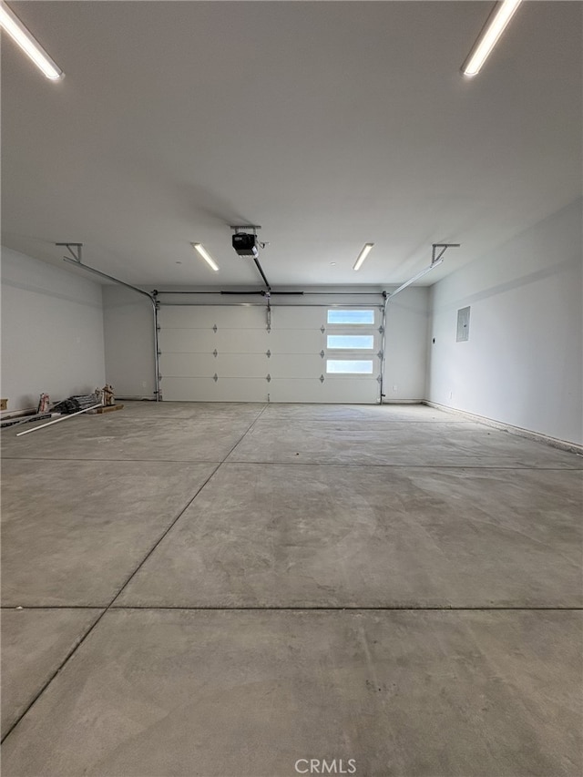 12525 Spring Valley Pkwy, Victorville, CA 92395 - garage featuring electric panel and a garage door opener