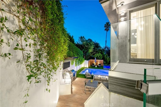 exterior space featuring a pool and a deck