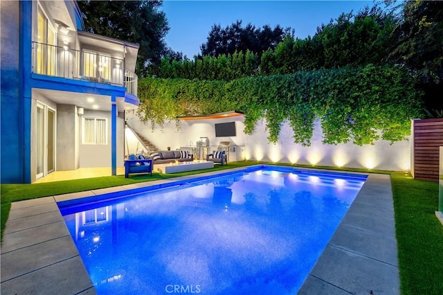 view of pool featuring a fenced in pool and an outdoor hangout area
