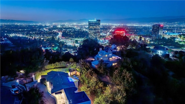 birds eye view of property with a view of city