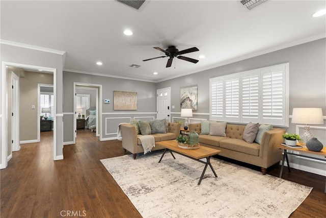 living area featuring visible vents and recessed lighting