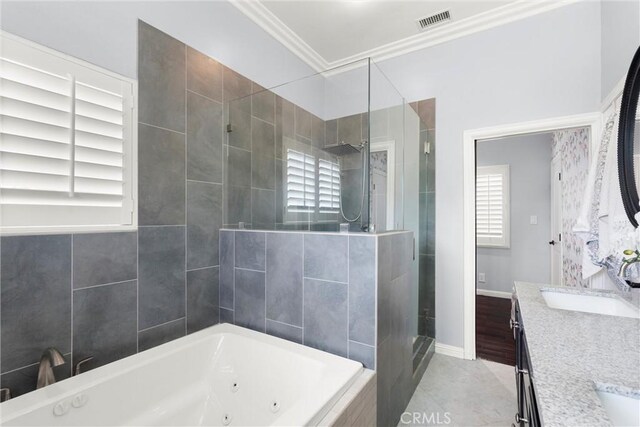 bathroom with a sink, a stall shower, visible vents, a jetted tub, and crown molding