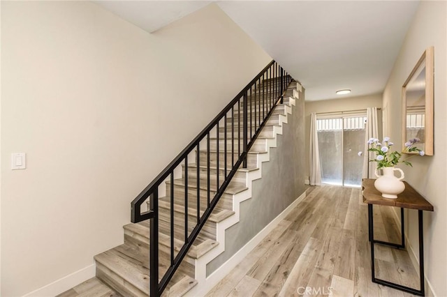 4164 Tujunga Ave Unit 102, Studio City, CA 91604 - stairway with baseboards and wood finished floors