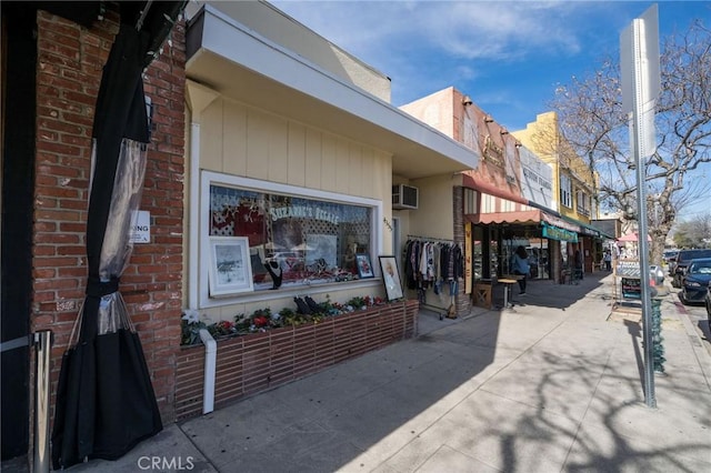 4164 Tujunga Ave Unit 102, Studio City, CA 91604 - view of side of home with a wall mounted AC and brick siding