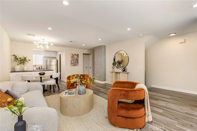 4164 Tujunga Ave Unit 102, Studio City, CA 91604 - living room with light wood-type flooring, recessed lighting, and a chandelier