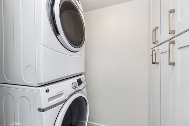 4164 Tujunga Ave Unit 102, Studio City, CA 91604 - washroom with stacked washing machine and dryer and cabinet space