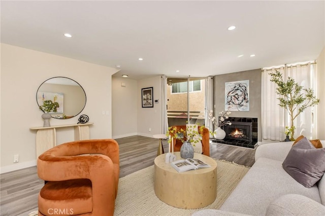 4164 Tujunga Ave Unit 102, Studio City, CA 91604 - living room featuring wood finished floors, recessed lighting, and a fireplace
