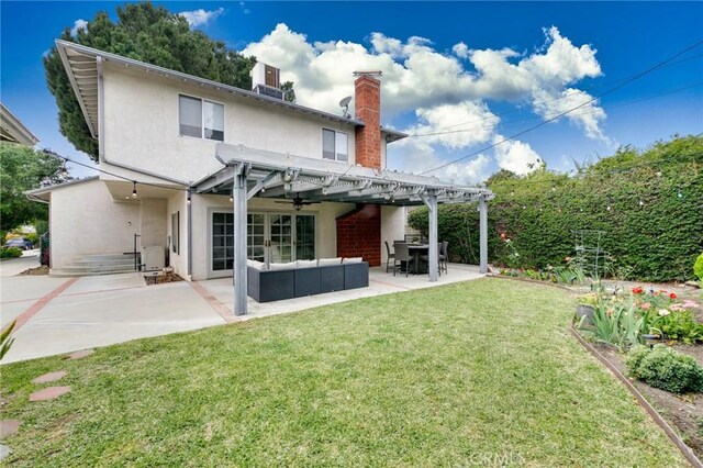 162 Acacia Ave, Monrovia, CA 91016 - rear view of house featuring a chimney, stucco siding, a lawn, an outdoor living space, and a patio