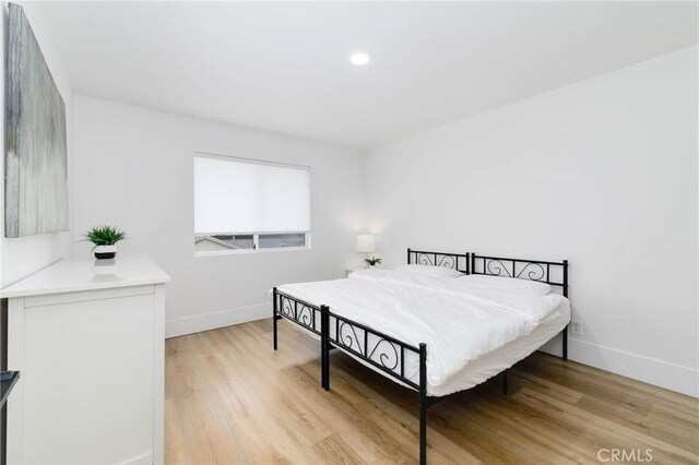 162 Acacia Ave, Monrovia, CA 91016 - bedroom with light wood-style flooring and recessed lighting