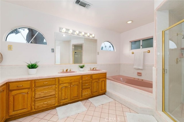 162 Acacia Ave, Monrovia, CA 91016 - full bathroom featuring tile patterned flooring, a garden tub, double vanity, and a stall shower