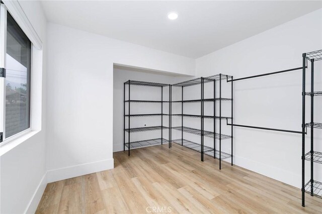 162 Acacia Ave, Monrovia, CA 91016 - walk in closet with light wood-style flooring