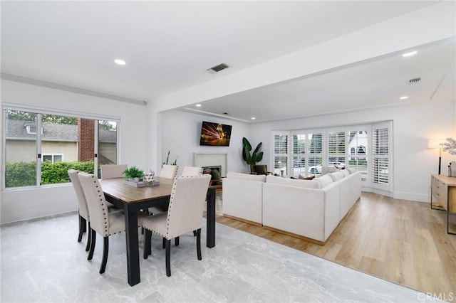 162 Acacia Ave, Monrovia, CA 91016 - dining area with plenty of natural light, recessed lighting, a fireplace, and light wood-type flooring