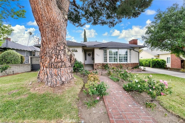 162 Acacia Ave, Monrovia, CA 91016 - view of front of house with brick siding, stucco siding, and a chimney
