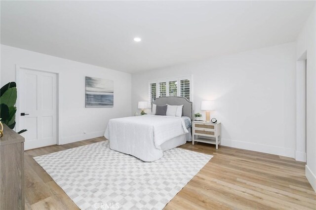 162 Acacia Ave, Monrovia, CA 91016 - bedroom with wood finished floors and recessed lighting