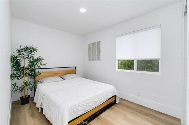162 Acacia Ave, Monrovia, CA 91016 - bedroom with light wood-style floors and recessed lighting