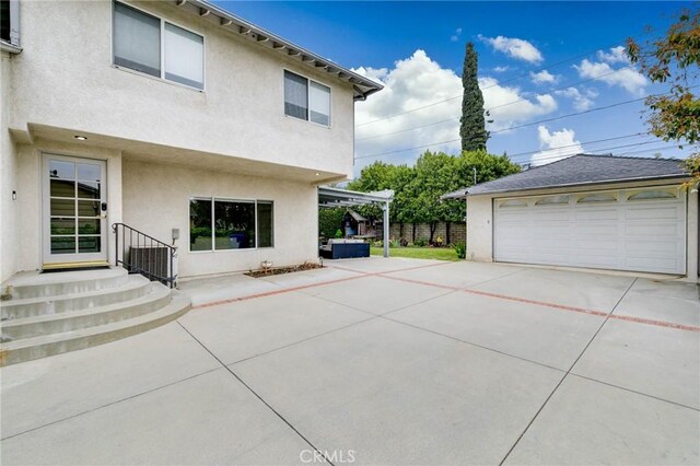 162 Acacia Ave, Monrovia, CA 91016 - exterior space featuring stucco siding, an outbuilding, and a detached garage