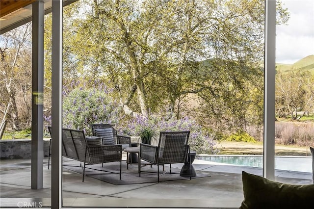 view of patio / terrace featuring an outdoor pool