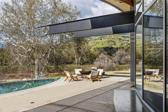 view of patio featuring an outdoor pool