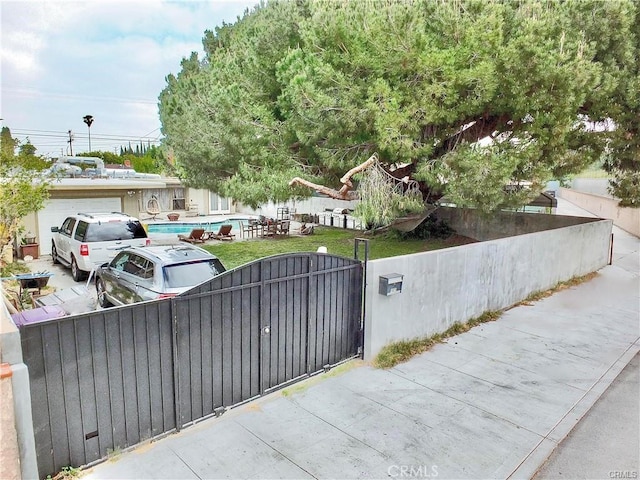 view of gate featuring a fenced front yard