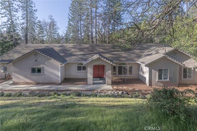 single story home featuring stucco siding
