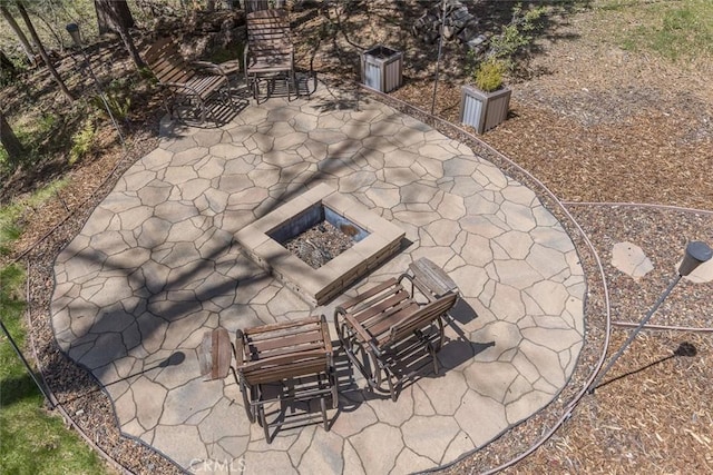 view of patio / terrace with a fire pit