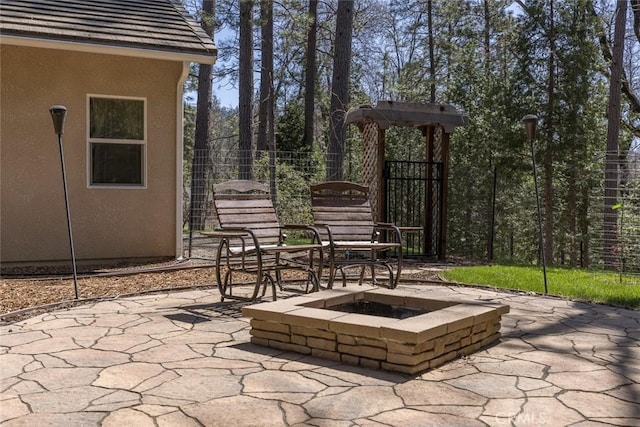 view of patio with a fire pit