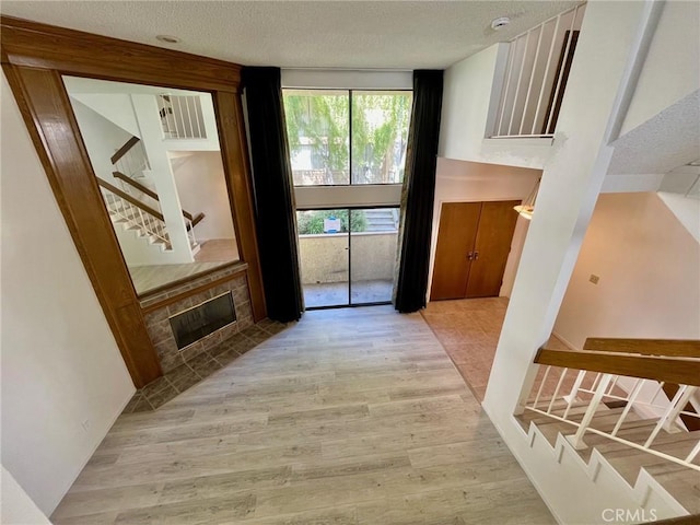 5444 Las Virgenes Rd, Calabasas, CA 91302 - entryway with visible vents, wood finished floors, a textured ceiling, and stairway