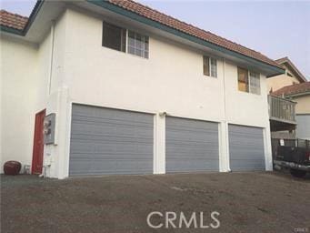 1150 Pacific Blvd, Oceano, CA 93445 - exterior space featuring a garage, a tile roof, driveway, and stucco siding