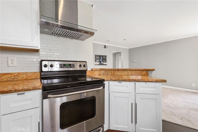 3408 Hathaway Ave Unit 301, Long Beach, CA 90815 - kitchen featuring electric stove, wall chimney exhaust hood, a peninsula, white cabinetry, and ornamental molding