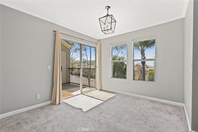 3408 Hathaway Ave Unit 301, Long Beach, CA 90815 - carpeted empty room with ornamental molding, baseboards, and a chandelier