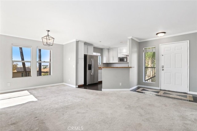 3408 Hathaway Ave Unit 301, Long Beach, CA 90815 - unfurnished living room featuring a chandelier, baseboards, crown molding, and dark colored carpet