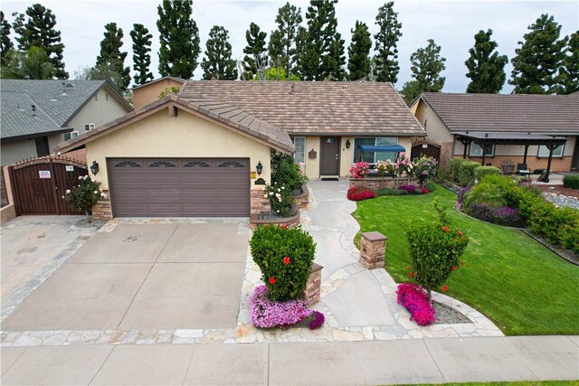 10629 El Este Ave, Fountain Valley, CA 92708 - single story home featuring a garage, concrete driveway, a front lawn, and stucco siding