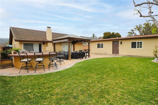 10629 El Este Ave, Fountain Valley, CA 92708 - rear view of property with a yard, a patio area, a chimney, and stucco siding