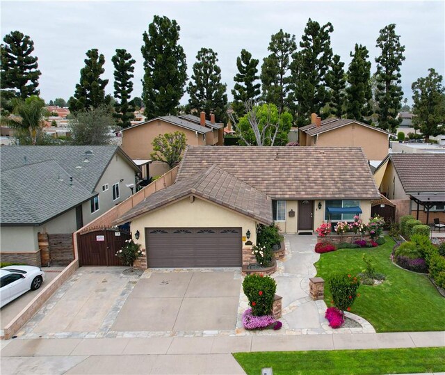 10629 El Este Ave, Fountain Valley, CA 92708 - single story home featuring a front lawn, concrete driveway, fence, an attached garage, and stucco siding