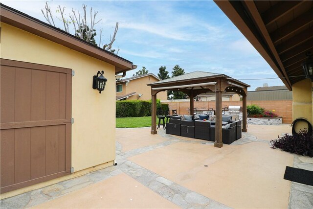 10629 El Este Ave, Fountain Valley, CA 92708 - view of patio / terrace featuring a gazebo, an outdoor living space, a storage shed, a fenced backyard, and an outdoor structure