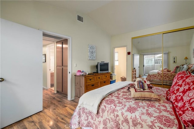27191 Ryan Dr, Laguna Niguel, CA 92677 - bedroom with lofted ceiling, wood finished floors, visible vents, and a closet