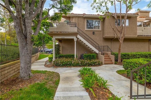 27191 Ryan Dr, Laguna Niguel, CA 92677 - exterior space featuring stairs, stucco siding, and fence