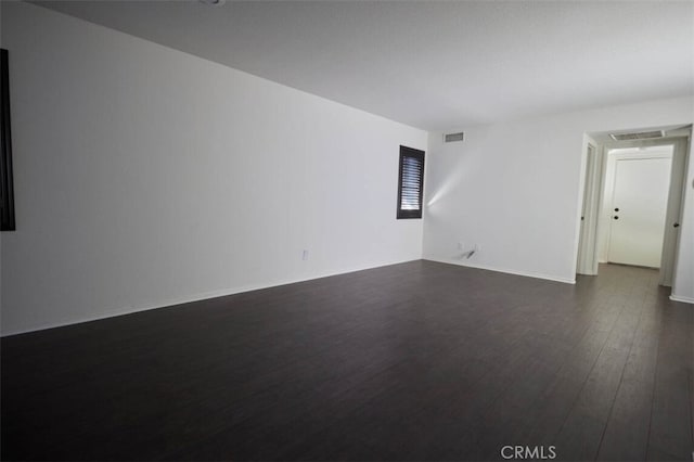 30069 Milano Rd, Temecula, CA 92591 - empty room featuring visible vents and dark wood-style floors