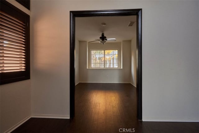 30069 Milano Rd, Temecula, CA 92591 - empty room featuring a ceiling fan, baseboards, and dark wood-style flooring