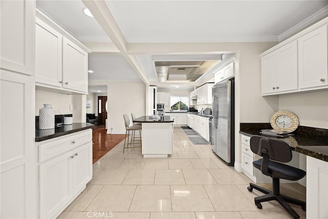 2700 Holly Ave, Arcadia, CA 91007 - kitchen featuring white cabinetry, appliances with stainless steel finishes, a breakfast bar, and built in desk