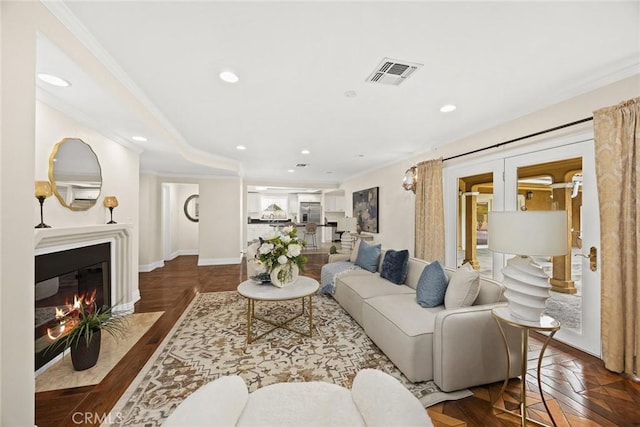 2700 Holly Ave, Arcadia, CA 91007 - living area featuring recessed lighting, a fireplace with flush hearth, visible vents, ornamental molding, and baseboards