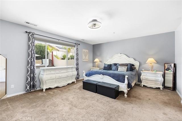 bedroom with carpet floors and baseboards