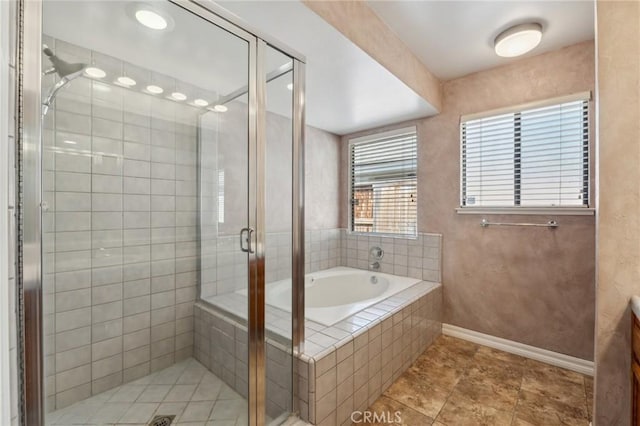 689 E Pintail Cir, Fresno, CA 93730 - bathroom with a stall shower, baseboards, tile patterned floors, and a bath