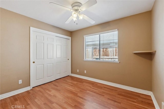 689 E Pintail Cir, Fresno, CA 93730 - unfurnished bedroom featuring ceiling fan, baseboards, light wood-type flooring, and a closet